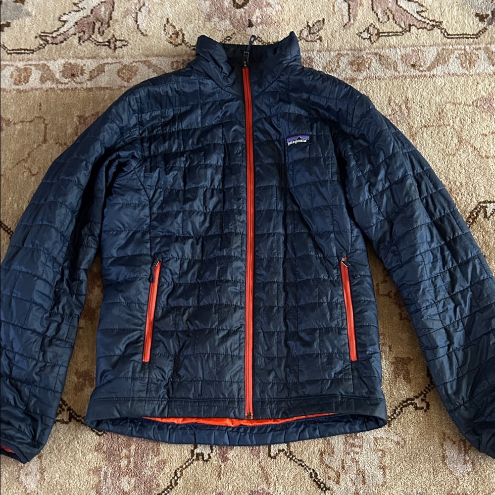 Patagonia Dark Blue Jacket with Bright Orange Trim